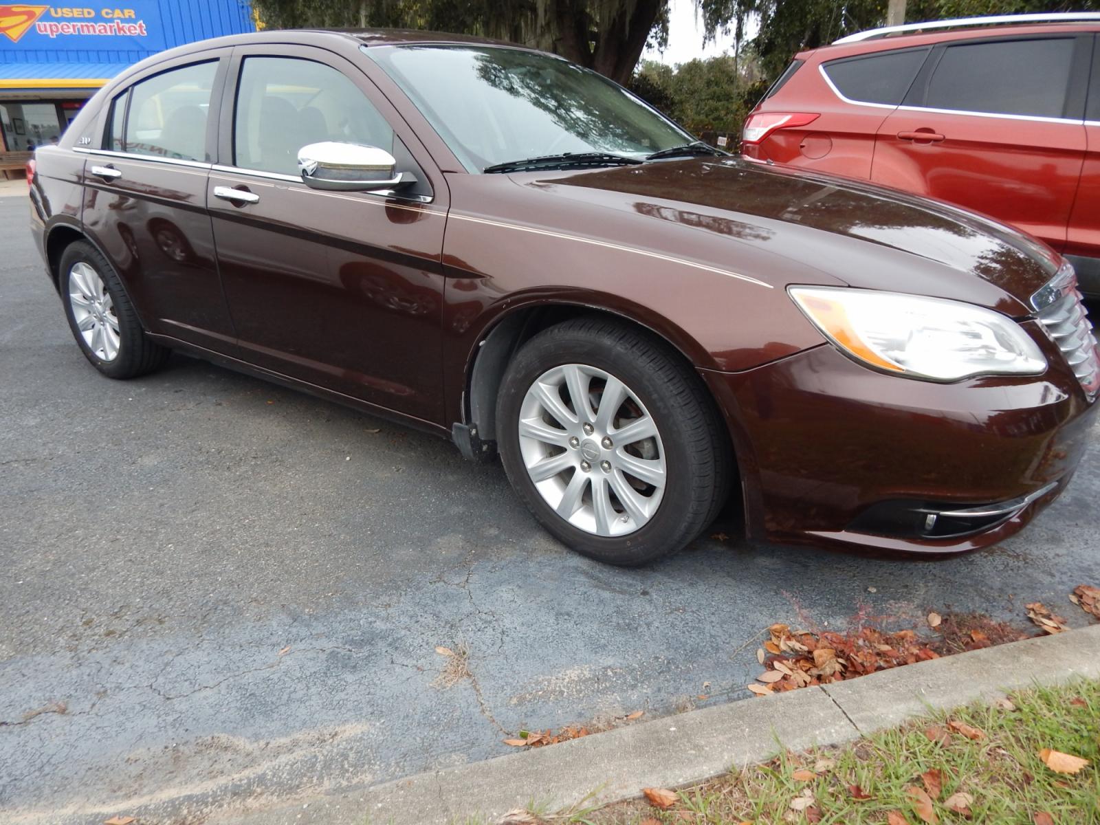 2013 Burgundy /Tan Leather Chrysler 200 Limited (1C3CCBCG3DN) with an 3.6L 6 Cyl. engine, Automatic transmission, located at 3120 W Tennessee St, Tallahassee, FL, 32304-1002, (850) 575-6702, 30.458841, -84.349648 - Used Car Supermarket is proud to present you with this loaded immaculate 2013 Chrysler 200 Limited with leather, sunroof and low miles. Used Car Supermarket prides itself in offering you the finest pre-owned vehicle in Tallahassee. Used Car Supermarket has been locally family owned and operated for - Photo #0